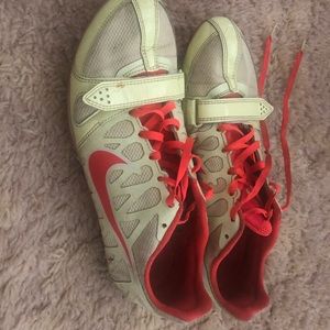Neon colored Nike track spikes in a 9.5